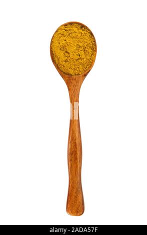 Turmeric powder in a wooden spoon on isolate. View from above. Spices in a spoon. Seasoning on isolate. Stock Photo