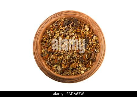 Mix of spices in a glossy cup isolated on white background. View from above. Seasoning on isolate. Dry spices. Stock Photo