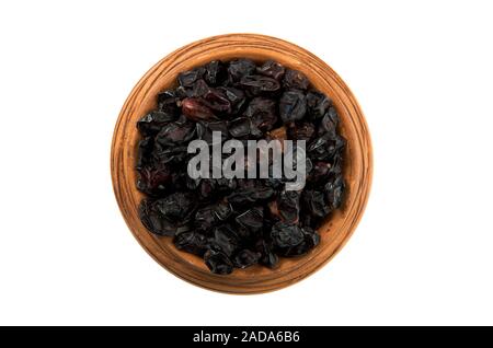 Dried barberry in a glossy cup isolated on a white background. Seasoning on isolate. View from above. Dry spices. Stock Photo