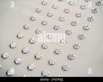 Close-up metallic dot tactile floor, blind path for blind people. Stock Photo