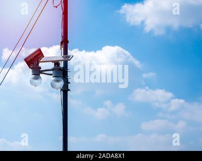 LED lighting and solar panel on pole on blue sky and clouds background on sunshine day with copy space. Stock Photo