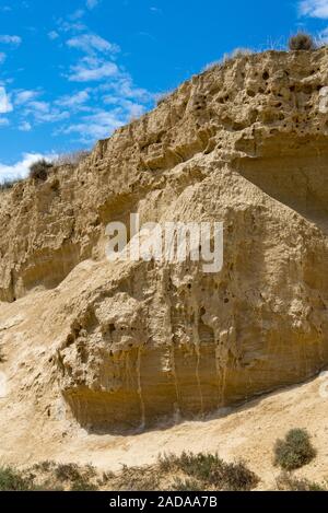 Stratified wall of the gorge in the Spanish badlands Bardenas Reales Stock Photo