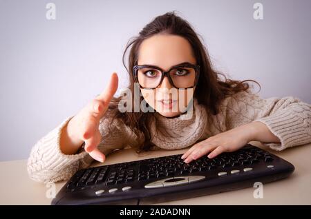 Funny nerd girl working on computer Stock Photo