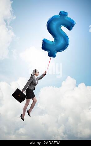 Businesswoman flying on dollar sign inflatable balloon Stock Photo - Alamy