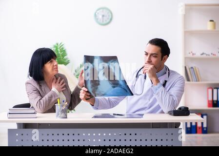 Young doctor examining senior old woman Stock Photo