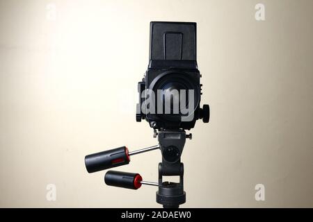 Photo of an old and vintage medium format film camera on a tripod Stock Photo