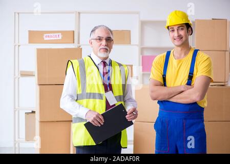 Professional movers doing home relocation Stock Photo