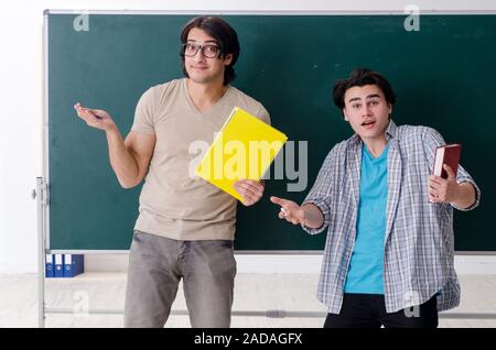 Two male students in the classroom Stock Photo