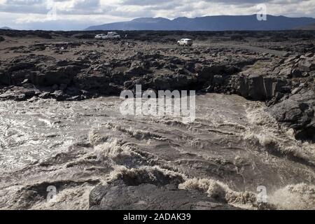 rapid glacier stream Kreppa in volcanic landscape with traffic, Highlands, Iceland, Europe Stock Photo