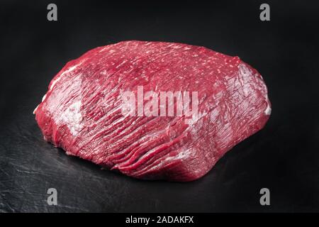 Raw dry aged wagyu thick flanch knuckle as closeup on black background with copy space Stock Photo