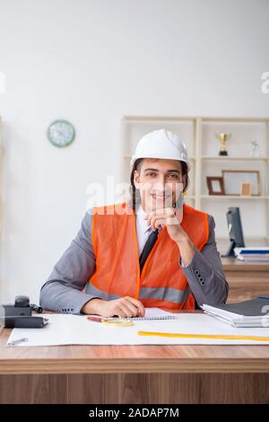 Young male architect working in the office Stock Photo