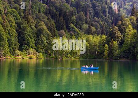 Artvin, Borcka/Turkey-06-05-2019: Unidentified people rowing in a boat in Savsat Karagol Nature Park in Blacksea region. Stock Photo