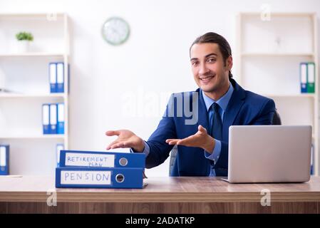 Young male accountant working in the office Stock Photo