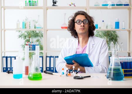 Funny male chemist working in the lab Stock Photo