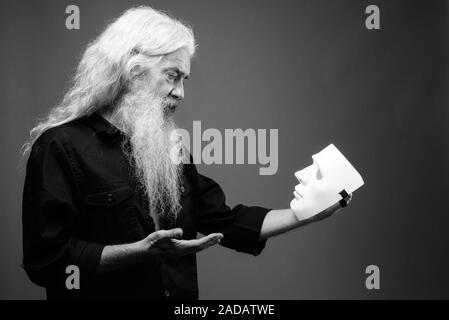 Senior man with long hair and beard in black and white Stock Photo