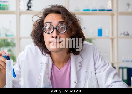 Funny male chemist working in the lab Stock Photo
