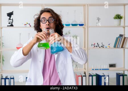 Funny male chemist working in the lab Stock Photo