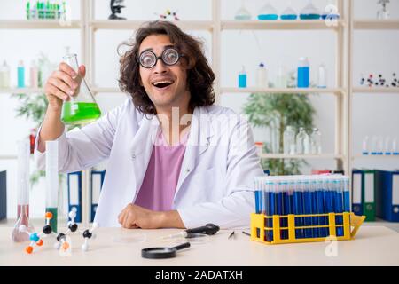 Funny male chemist working in the lab Stock Photo