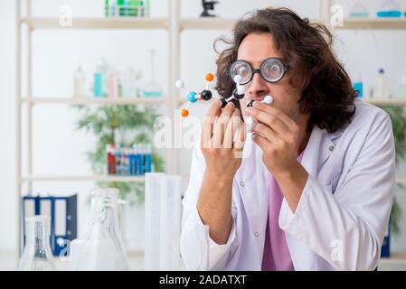 Funny male chemist working in the lab Stock Photo
