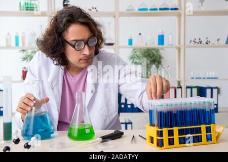 Funny male chemist working in the lab Stock Photo
