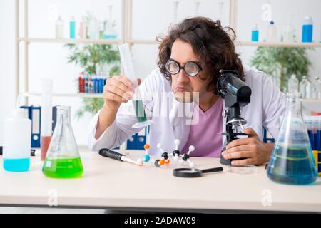 Funny male chemist working in the lab Stock Photo