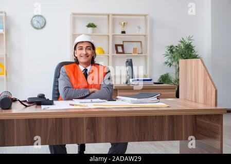 Young male architect working in the office Stock Photo