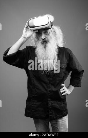 Senior man with long hair and beard in black and white Stock Photo