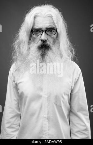 Senior man with long hair and beard in black and white Stock Photo