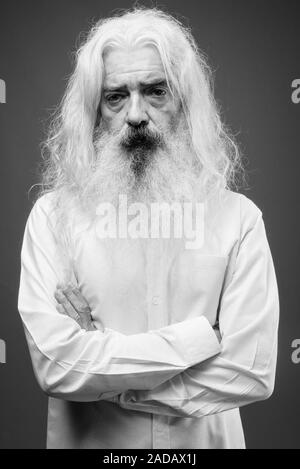 Senior man with long hair and beard in black and white Stock Photo