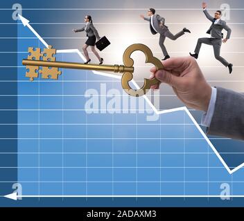 Business people chasing each other towards key to success Stock Photo