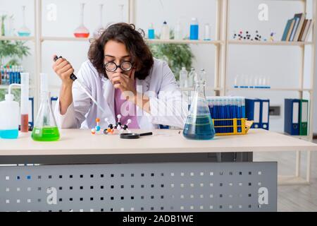 Funny male chemist working in the lab Stock Photo