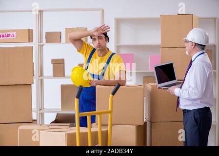 Professional movers doing home relocation Stock Photo