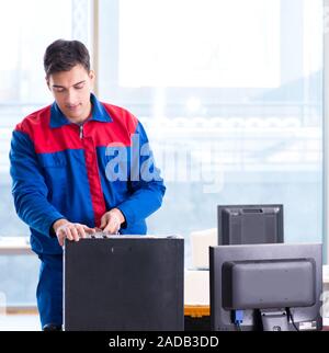 Computer repairman specialist repairing computer desktop Stock Photo