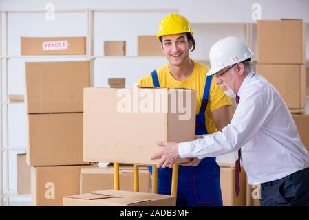 Professional movers doing home relocation Stock Photo