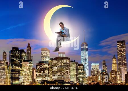 Student reading book on the moon crescent Stock Photo