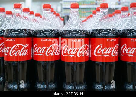 Tyumen, Russia-August 27, 2019: Plastic bottles of Coca Cola on display on Coca Cola stand during. Coca Cola Company is leading soda drinks manufactur Stock Photo