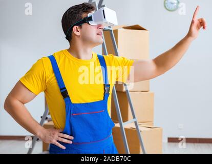 The painter contractor working with virtual reality goggles Stock Photo