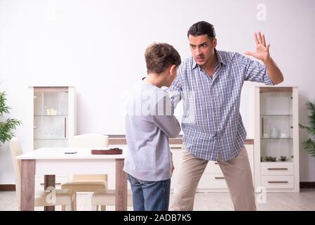Father beating and punishing his sone Stock Photo