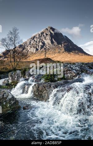 This is  Etive Mor Waterfall  in Glencoe of the Scottish Highlands. Bauchaille mountain can be seen in the distance. Stock Photo