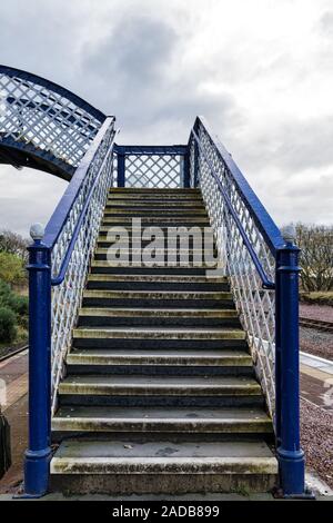 This is an old victorian foot bridge at the remote trainstation at Ronnoch in the Scottish Highlands Stock Photo