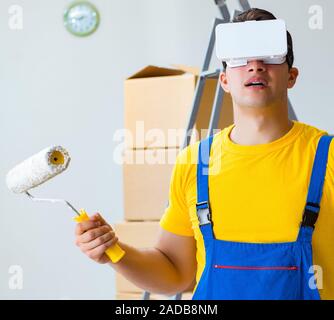 Painter contractor working with virtual reality goggles Stock Photo