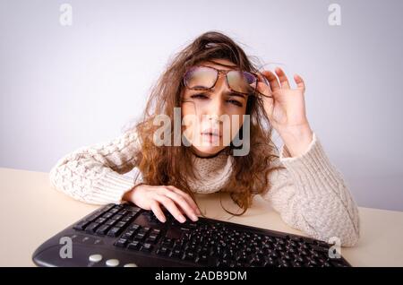 Funny nerd girl working on computer Stock Photo