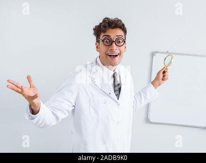 Funny doctor scientist making presentation in hospital Stock Photo