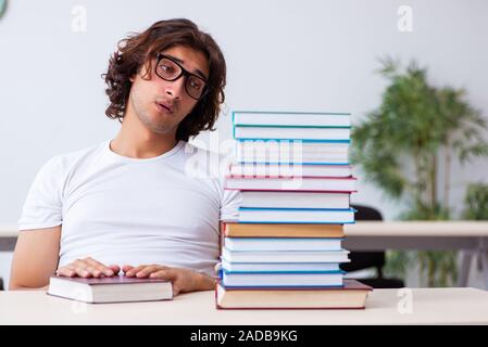 Young male student sitting in the classroom Stock Photo