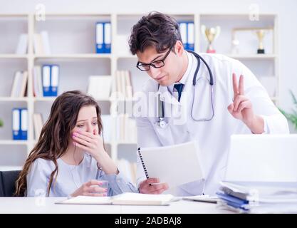 Doctor sharing discouraging lab test results to patient Stock Photo