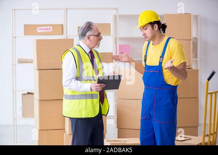 Professional movers doing home relocation Stock Photo