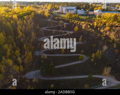 Aerial top vew of winding road in the city Stock Photo