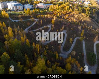 Aerial top vew of winding road in the city Stock Photo