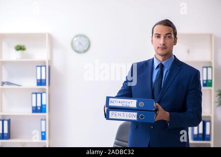 Young male accountant working in the office Stock Photo