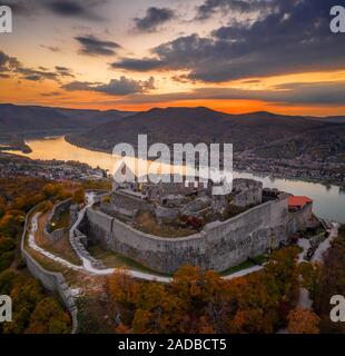 Visegrad, Hungary - Aerial panoramic drone view of the beautiful high castle of Visegrad with autumn foliage and trees. Danube Bend (Dunakanyar) and a Stock Photo